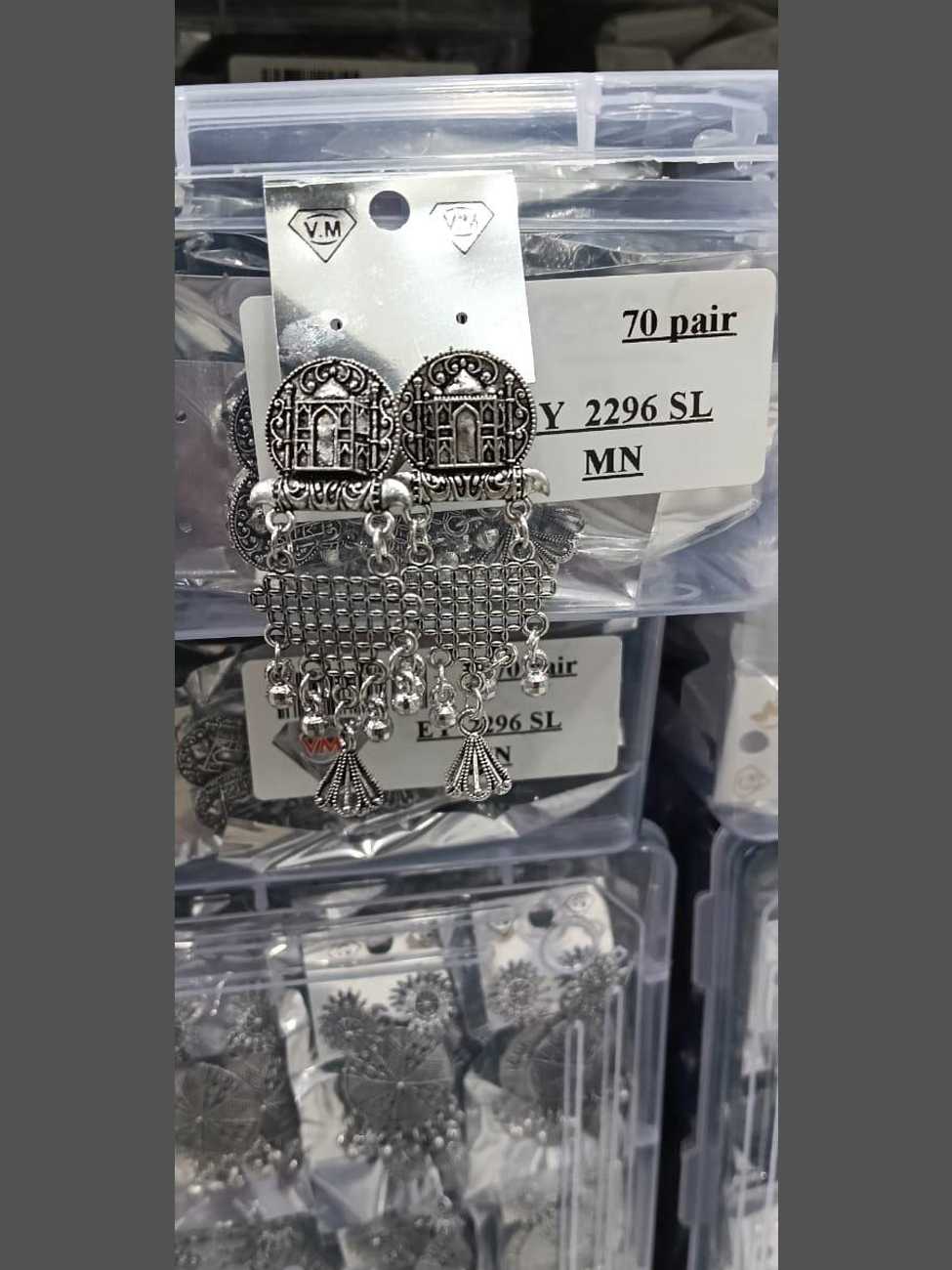 Ethnic oxidized silver earrings featuring Taj Mahal architectural motifs and mesh-style danglers