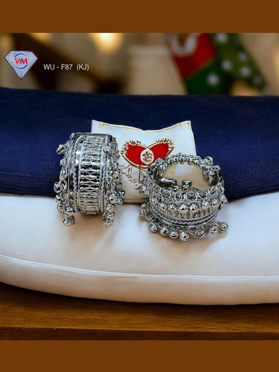 Oxidized silver kada with layered ghungroo band and traditional design