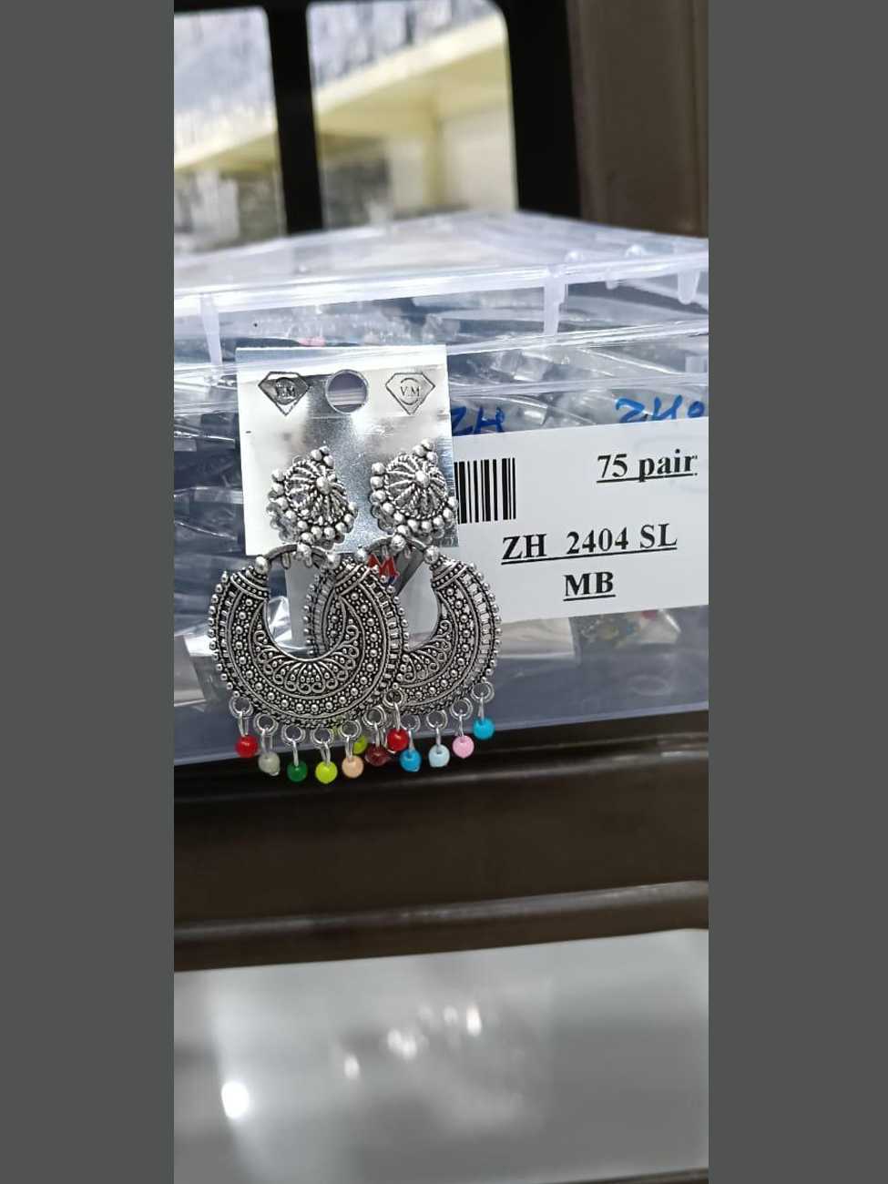 Handcrafted oxidized silver crescent-shaped chandbalis featuring vibrant multicolored bead drops