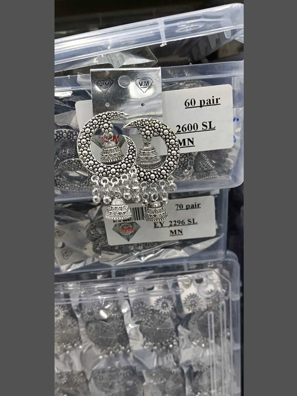 Oxidized silver moon-crescent bali earrings featuring a central jhumka and hanging bead accents