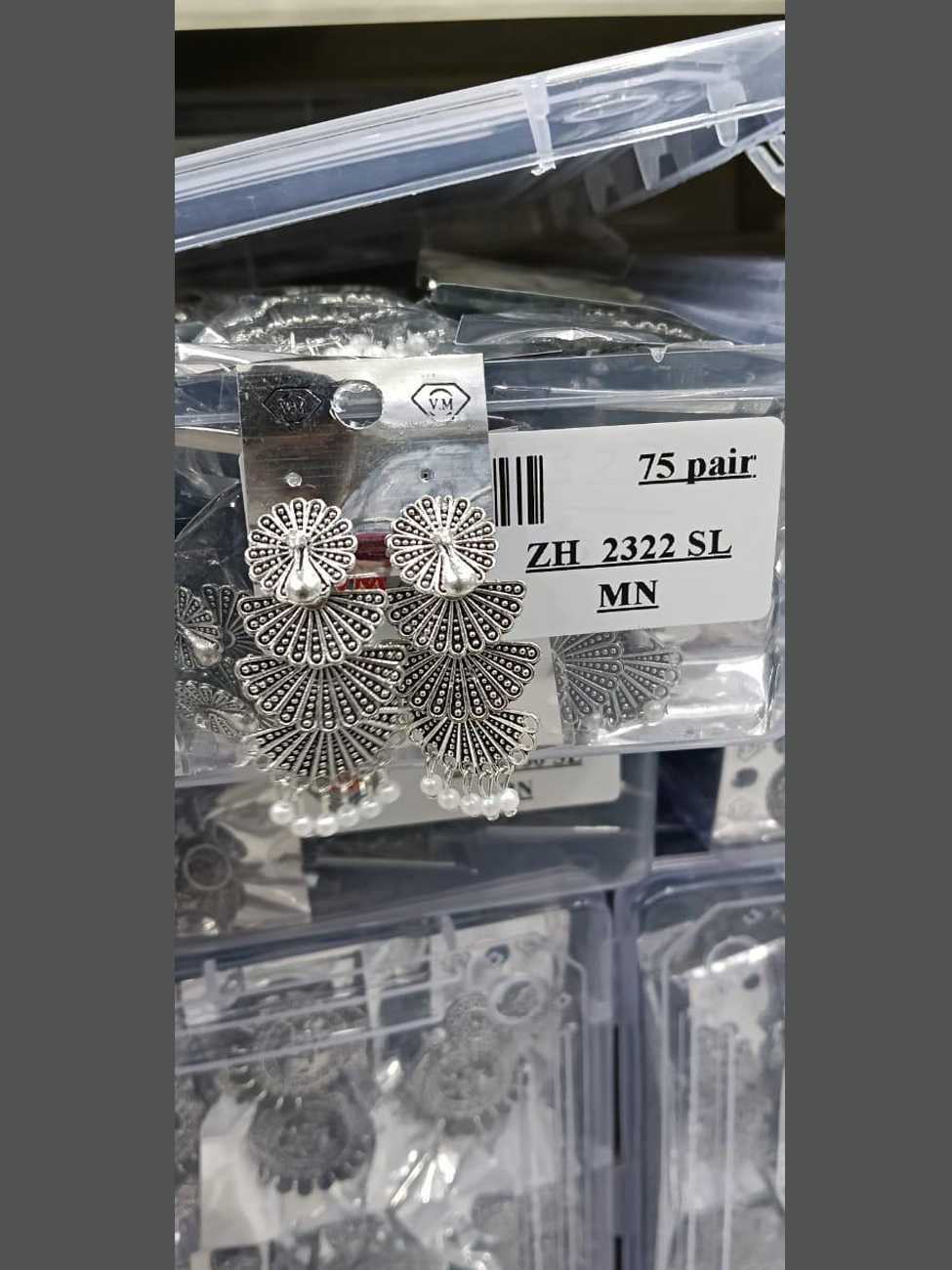 Three-tiered peacock fan oxidized silver earrings accented with small white pearl beads.