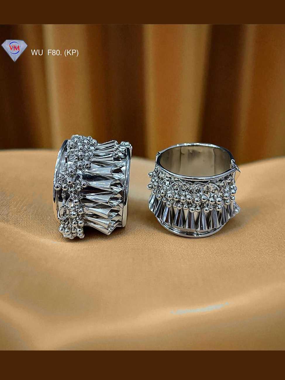 Oxidized silver kada featuring cone fringe drops and textured surface