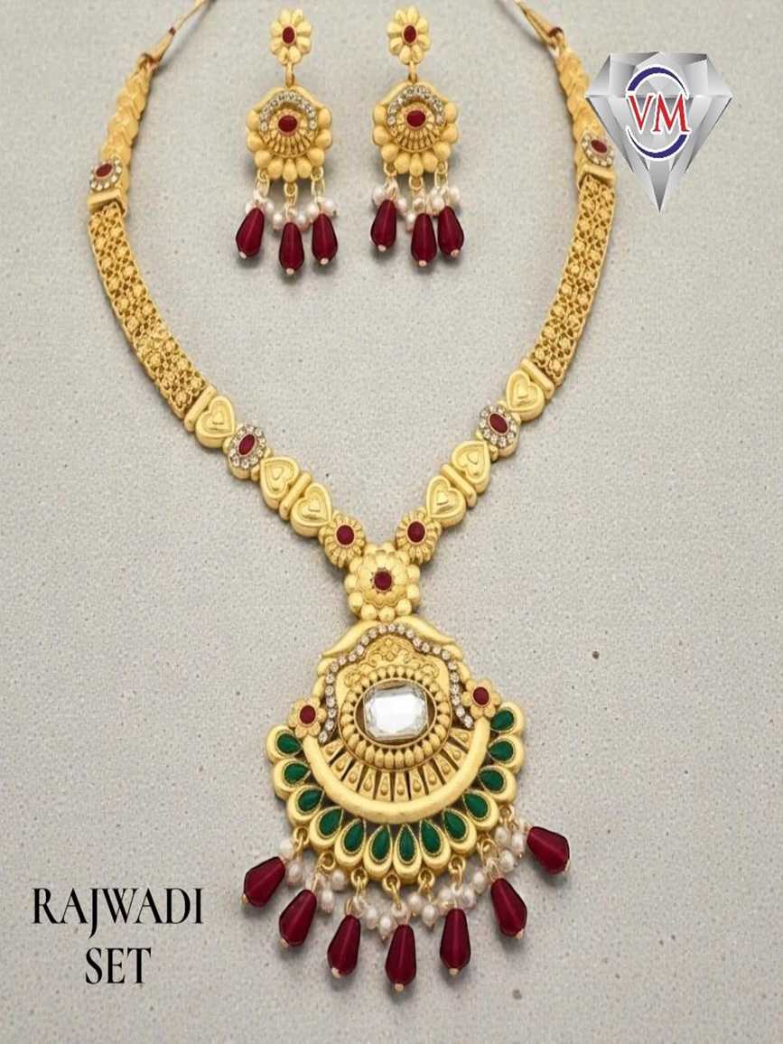 Gold finish Rajwadi necklace set with circular kundan pendant, green enamel detailing and ruby bead drops with matching earrings