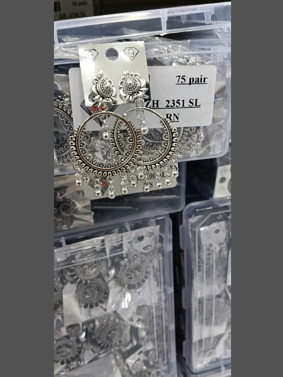 Circular hoop-style oxidized silver Bali earrings with a fringe of small silver beads.