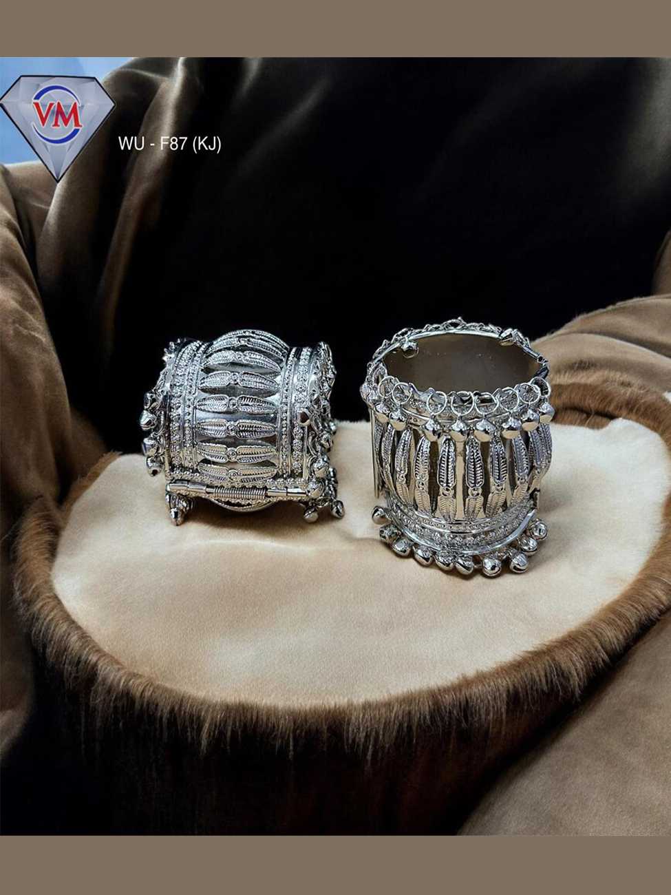 Oxidized silver kada featuring peacock engraving and bell drop detailing