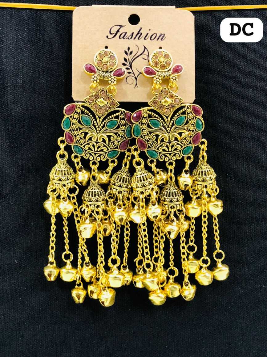 Ornate gold-plated chandelier earrings featuring green and maroon stones with multiple dangling Jhumka bells and golden chains.