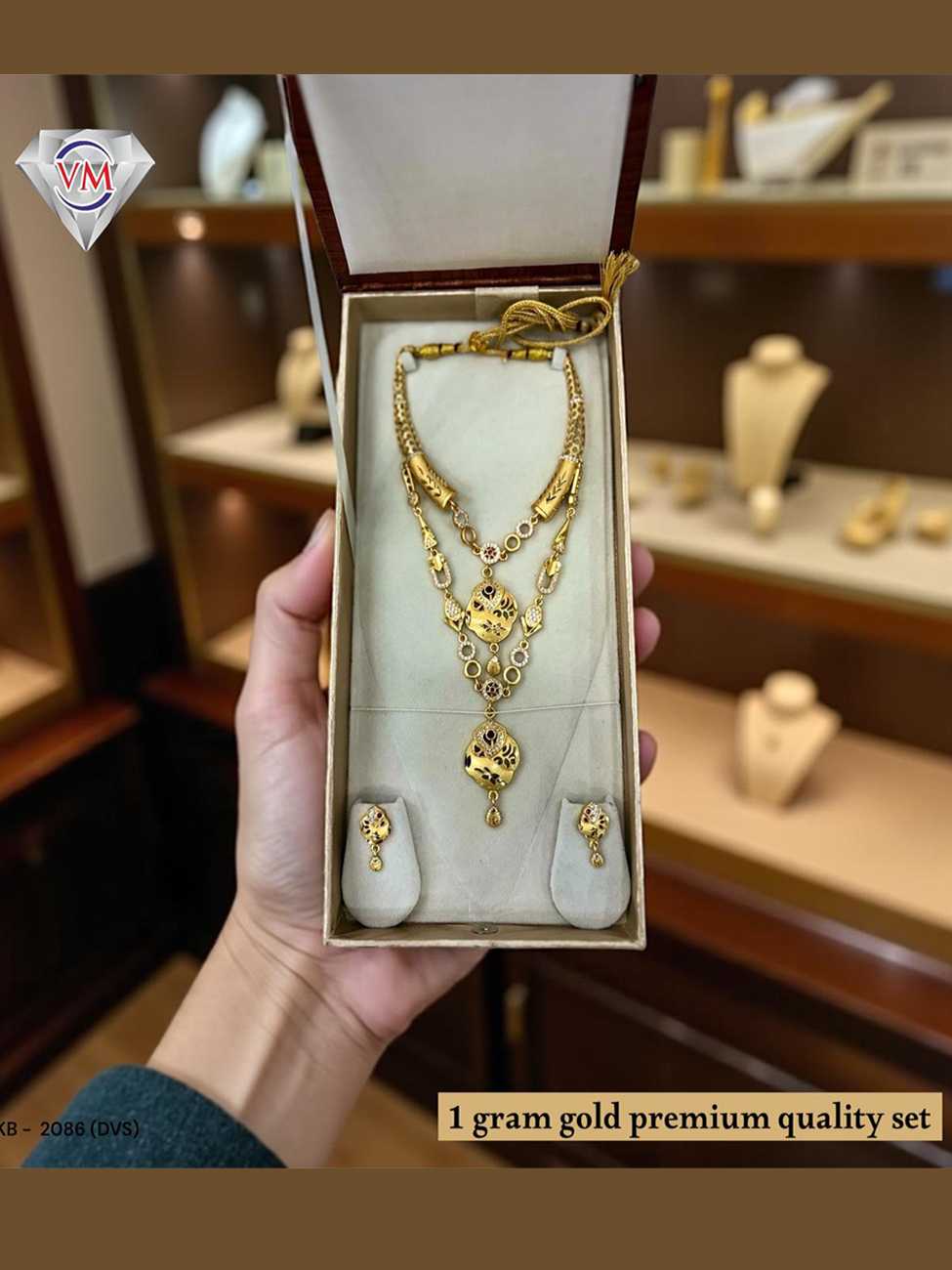 complete view of 1 gram gold premium layered necklace set with matching earrings
