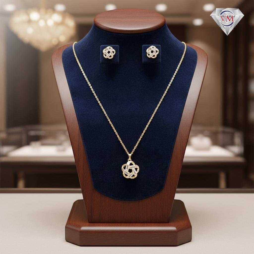 Gold-plated necklace set with a circular intertwined knot pendant and matching studs encrusted with baguette cubic zirconia.