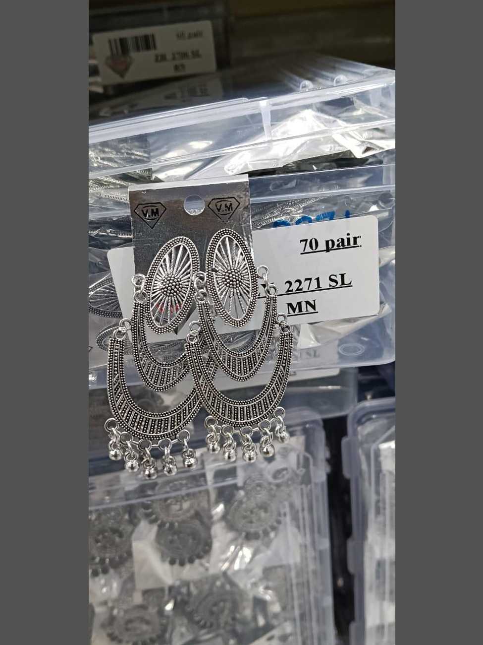 Detailed oxidized silver earrings featuring an oval sunburst stud and triple-layered crescent moon frames with silver bead accents.