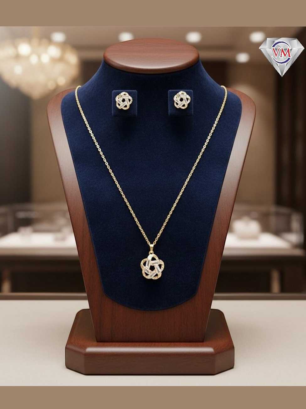 Gold-plated jewelry set with a five-pointed intertwined star pendant and matching studs encrusted with baguette-cut crystals.